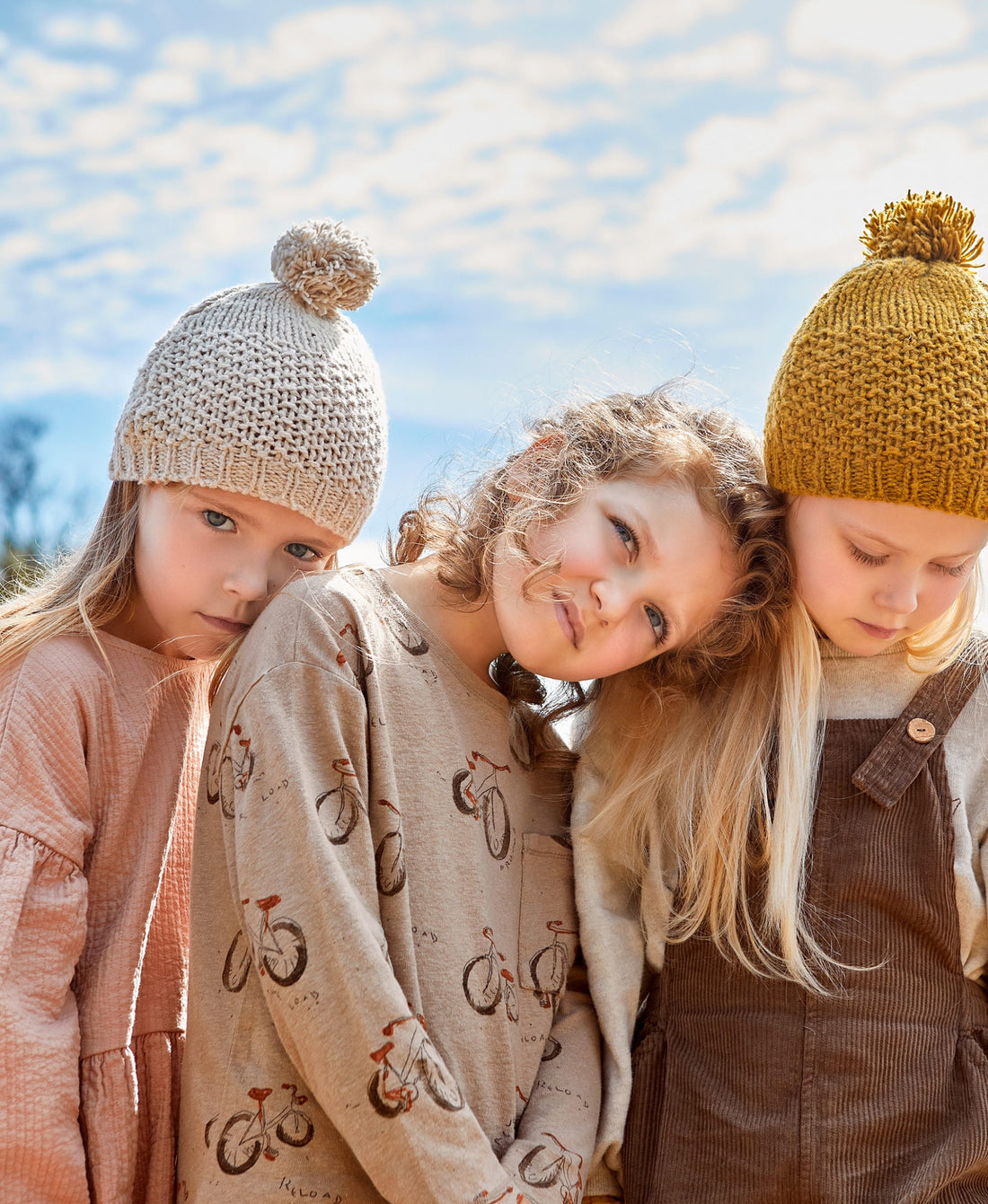 Knitted beanie with pompom on top