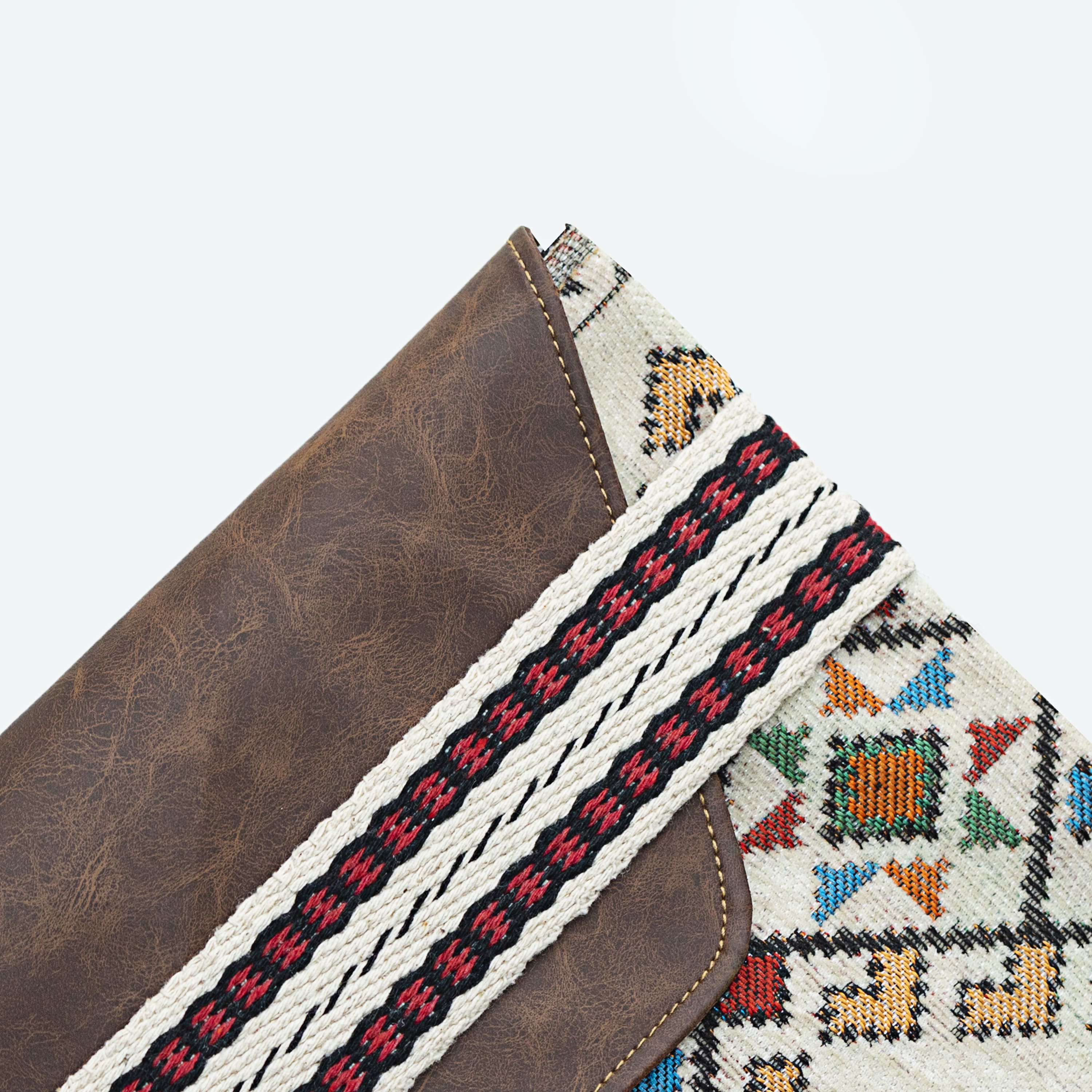 Dark brown leather bag with a heritage print